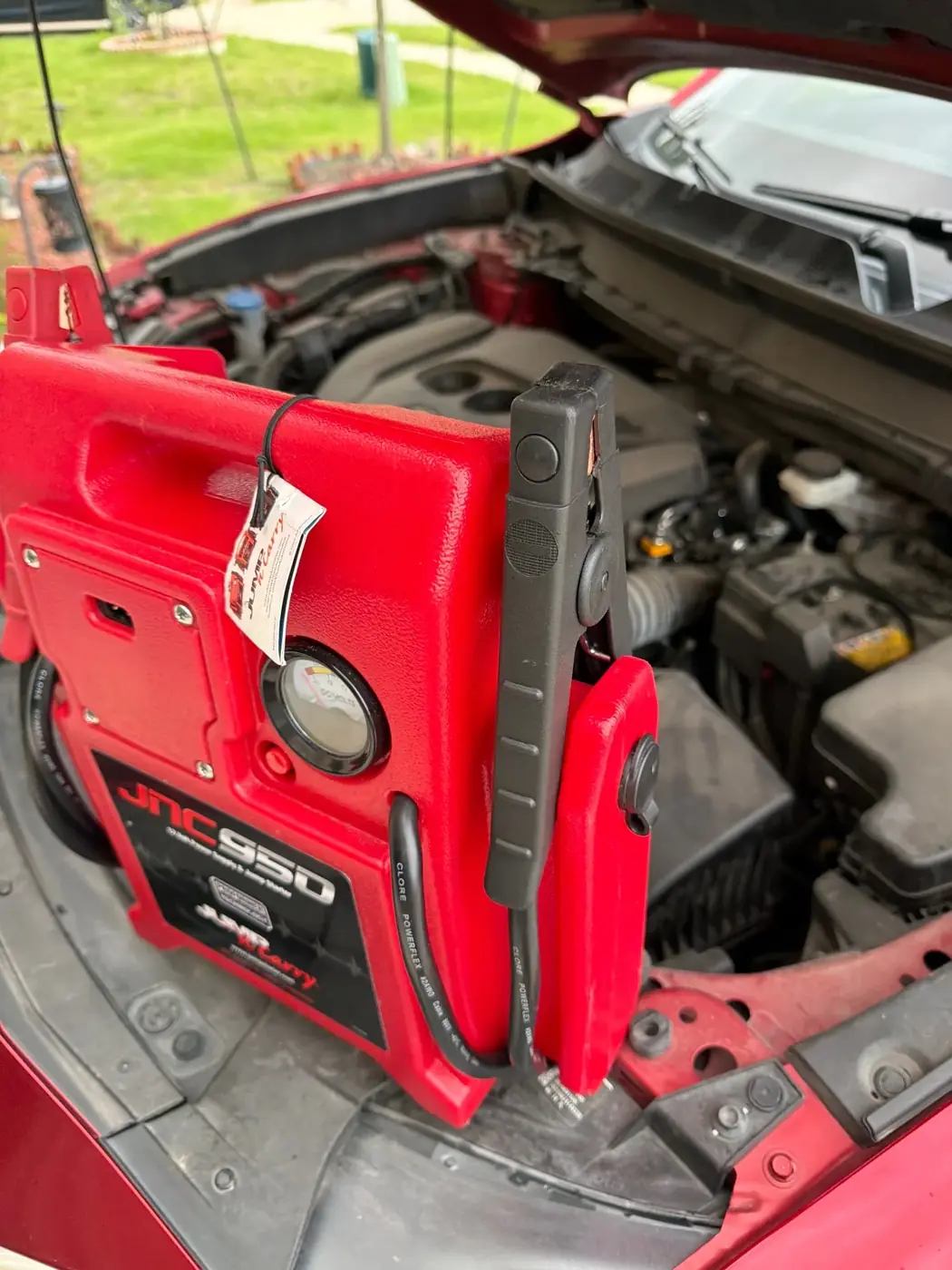 JNC950 commercial jump starter pack staged on a vehicle during a Dallas-Fort Worth mobile jump start service call.